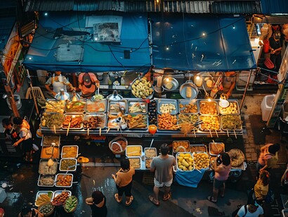 A bustling night market filled with food stalls and people, representing Ormoc’s vibrant community life and shared sense of belonging