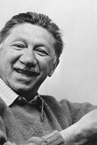 Abraham Maslow, smiling at the camera