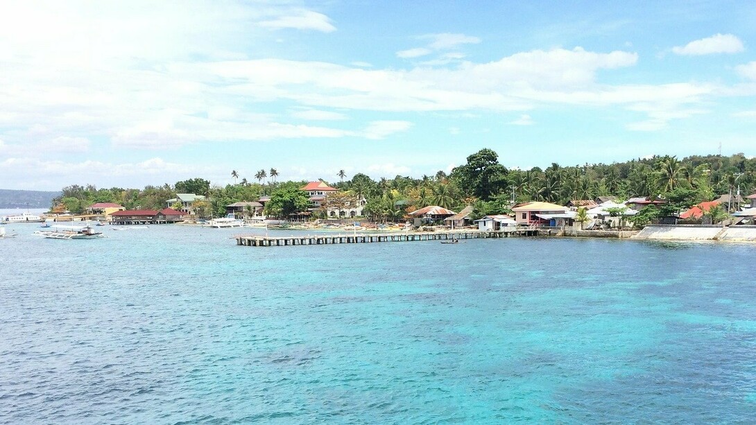 The Ormoc Pier stretching into the sea, symbolising Ormoc’s role as a gateway for people, trade, and opportunity