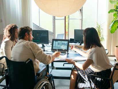 A group of people meeting in an accessible office, reflecting disability inclusion in the workplace