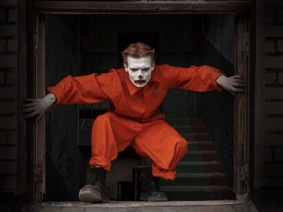 A clown crouched, embodying how western cinema often compresses Russian identity into threatening one dimension roles