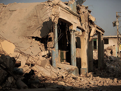 Aleppo during the Syrian conflict, with buildings in ruins and a war-torn landscape, vividly captures the devastation in Syria