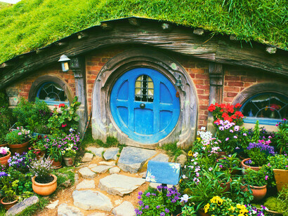 Small underground homes nestled in the earth  in New Zealand, representing the harmony between shelter and landscape