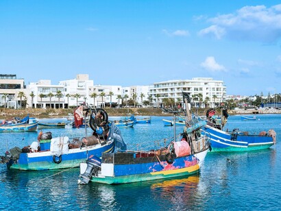Colourful fishing boats in Rabat Harbour, representing how the country values its maritime heritage and the importance of fishing in its economy