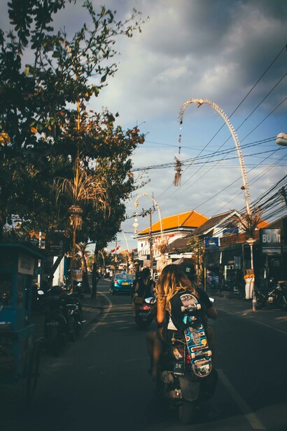 Daily life in Canggu, Bali: a scooter zips through the vibrant streets of this coastal town