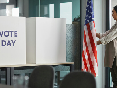 Women taking part in voting during the New York mayoral election, highlighting civic engagement in New York City politics