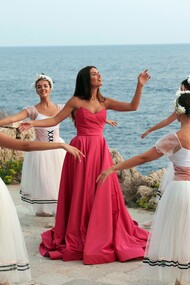 Tamara Radjenovic (center) singing while being surrounded by ballet dancers