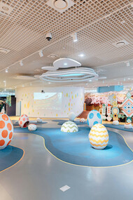 Interior of a modern pediatric ward with colorful seating, designed to create a welcoming and family-friendly environment for young patients