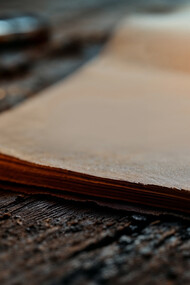 A pen and white pages, itching for a hand to bring it to life