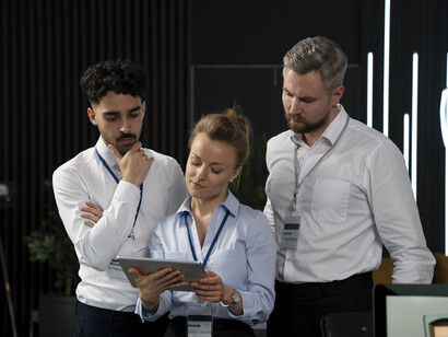 A team united by a shared vision, collaborating with advanced technology to drive innovation and unlock collective human potential