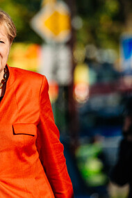Angela Merkel in a vibrant red suit