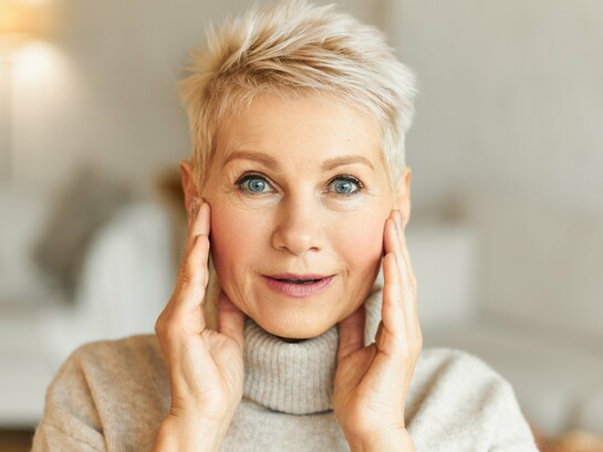 An energetic older woman with glowing skin, capturing the goal of increasing vitality rather than chasing immortality