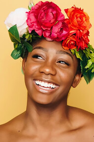 Woman smiling wearing flower crown
