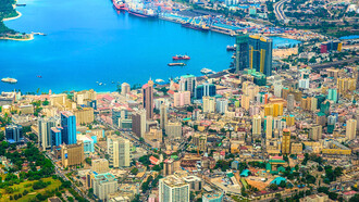 The skyline in Dar es Salaam, Tanzania, represents the need for urban development in the modern world