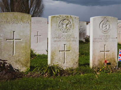 Delville Wood Cemetery in Longueval, France, with a British flag marking a soldier’s grave