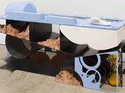 Holly Hendry, 'You Are What You Eat', 2020. Steel,
glass, plaster, terracotta, sand, paint, motor and
silicone, 101 x 195 x 70cm (39 3/4 x 76 3/4 x 27
1/2in). Copyright Holly Hendry. Courtesy the artist
and Stephen Friedman Gallery, London. Photo by
Mark Blower