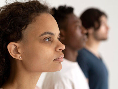 People from diverse cultures standing together, reflecting cultural diversity, biases, and communication challenges