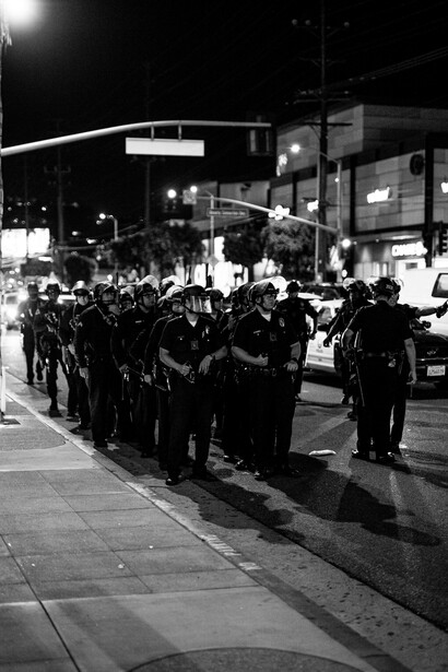 Police forces deployed on the streets amid protests, such as Black Lives Matter, reflecting the ongoing struggle between human rights activists and law enforcement
