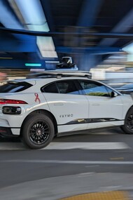 A sleek Waymo robotaxi cruises through San Francisco, symbolizing the city’s leap into an autonomous driving future