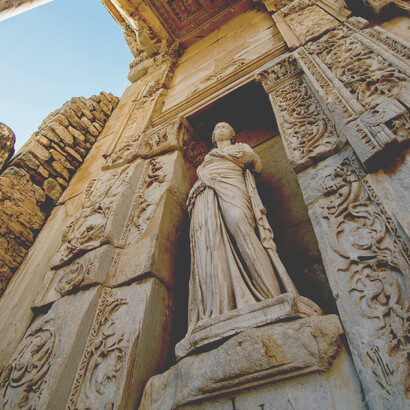 An ancient Greek sculpture standing among the timeless ruins of Ephesus, Turkey