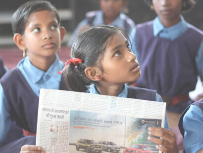 A group of Indian children learning in a classroom environment