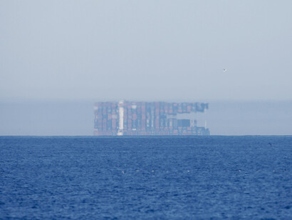 Fata Morgana mirage of a cargo ship off the coast of Oceanside, San Diego, California, 7 April 2022, US