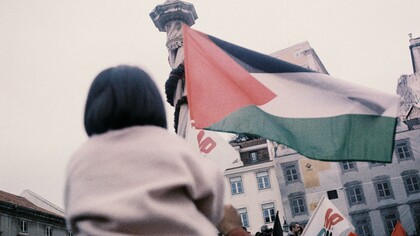 Lisbon, Portugal a child holding a Palestinian flag during a protest