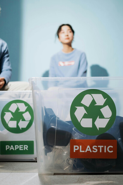 Waste being sorted into boxes as part of smart waste management