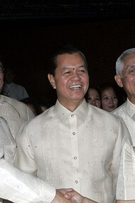 Benigno Simeon Aquino III, the 15th President of the Philippines who served from 2010 to 2016, dons a Barong Tagolog while shaking hands with Gloria Macaraeg Macapagal-Arroyo, the 14th President of the Philippines who served from 2001 to 2010, at Aquino's inauguration at the Malacañang Palace, in Manila, Philippines, on the 30th of June, 2010