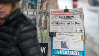Newspapers displayed on the streets of France, capturing the essence of daily life and media culture