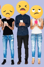 People holding emoji faces while making negative comments on social media, depicting trolling behavior in the online sphere