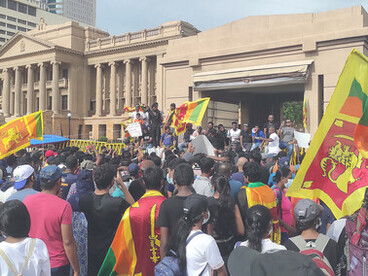 Young protesters chant slogans outside Sri Lanka’s Presidential Secretariat during mass anti-government protests, April 13, 2022
