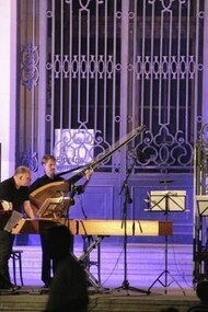 Open-air concert at the Bode Museum in Berlin centre after sunset.