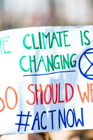 A sing at a demonstration urging for action against climate change