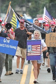 Demonstrators march against the wearing of face masks in downtown Sanford, Florida, where locals, like their pioneer forebears, have been resisting government orders © Joe Burbank/Orlando Sentinel/AP 