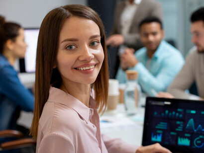 Office professionals using computers to analyze real estate data visualizations and property market trends, with the help of AI-driven insights