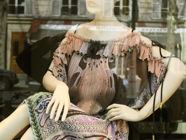 A stylish mannequin displayed in a Paris storefront, Île-de-France