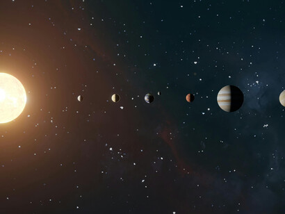 Planets of the solar system orbiting the Sun against a dark, star-filled sky