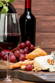 Rustic wooden barrel paired with wine, tapas, and a variety of cheeses