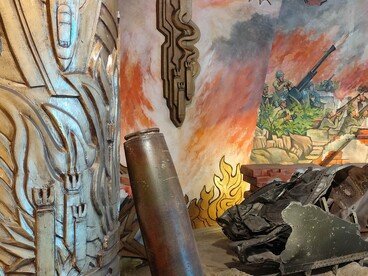 War remnants set against fiery murals create an immersive journey through Vietnam’s turbulent history © Photo by Daniel Gauss