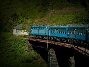 Badulla-Colombo high-altitude railway winding through natural forest mountains and valleys, cascading torrents and waterfalls