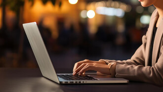 A professional working remotely from a cozy café, blending productivity with a relaxed atmosphere