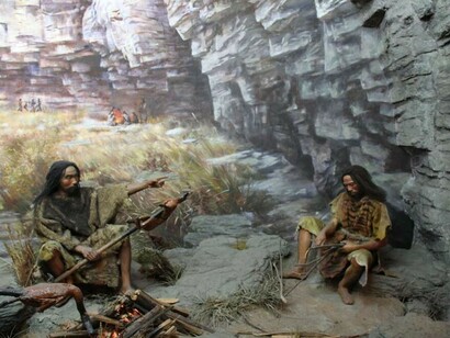 A realistic reconstruction of Late Paleolithic humans shown in a diorama setting