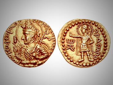 Coin of Kushan King Huvishka (circa CE 152–192) depicting the diademed king on the obverse and the deity Ashaiexsho on the reverse. Ashaiexsho, believed to be associated with Zoroastrian or Iranian religious traditions, reflects the syncretic pantheon embraced by the Kushans. The use of Bactrian script and the inclusion of such diverse deities illustrate the empire’s role as a cultural crossroads between East and West