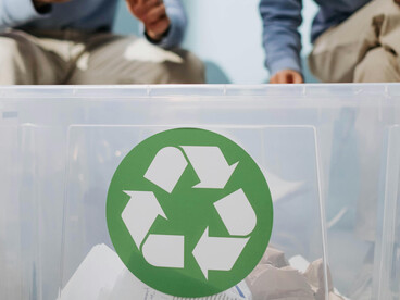 Sorting waste into designated bins, representing smart waste management