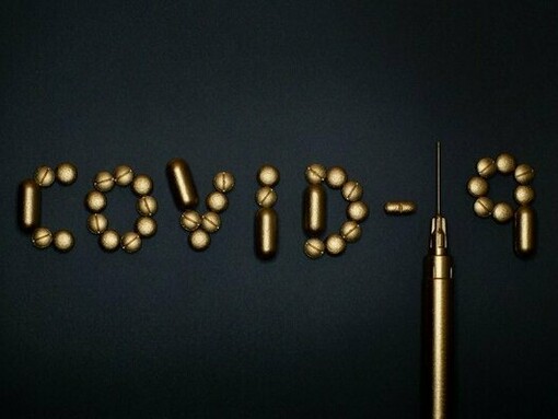 COVID-19 assembled from capsules and a syringe, reflecting how health crises test people’s confidence in experts