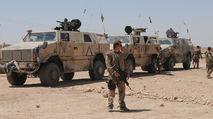 German Army soldiers in Afghanistan in front of Dingo infantry mobility vehicles, 2009