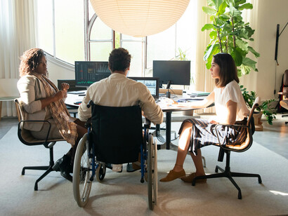 An inclusive workplace meeting in an accessible office environment