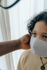 Children taking off the protective mask from the COVID virus even in the aftermath