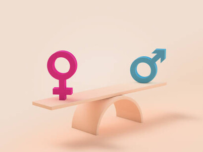 Gender equality is symbolized by a scale, where the male and female symbols are perfectly balanced on either side